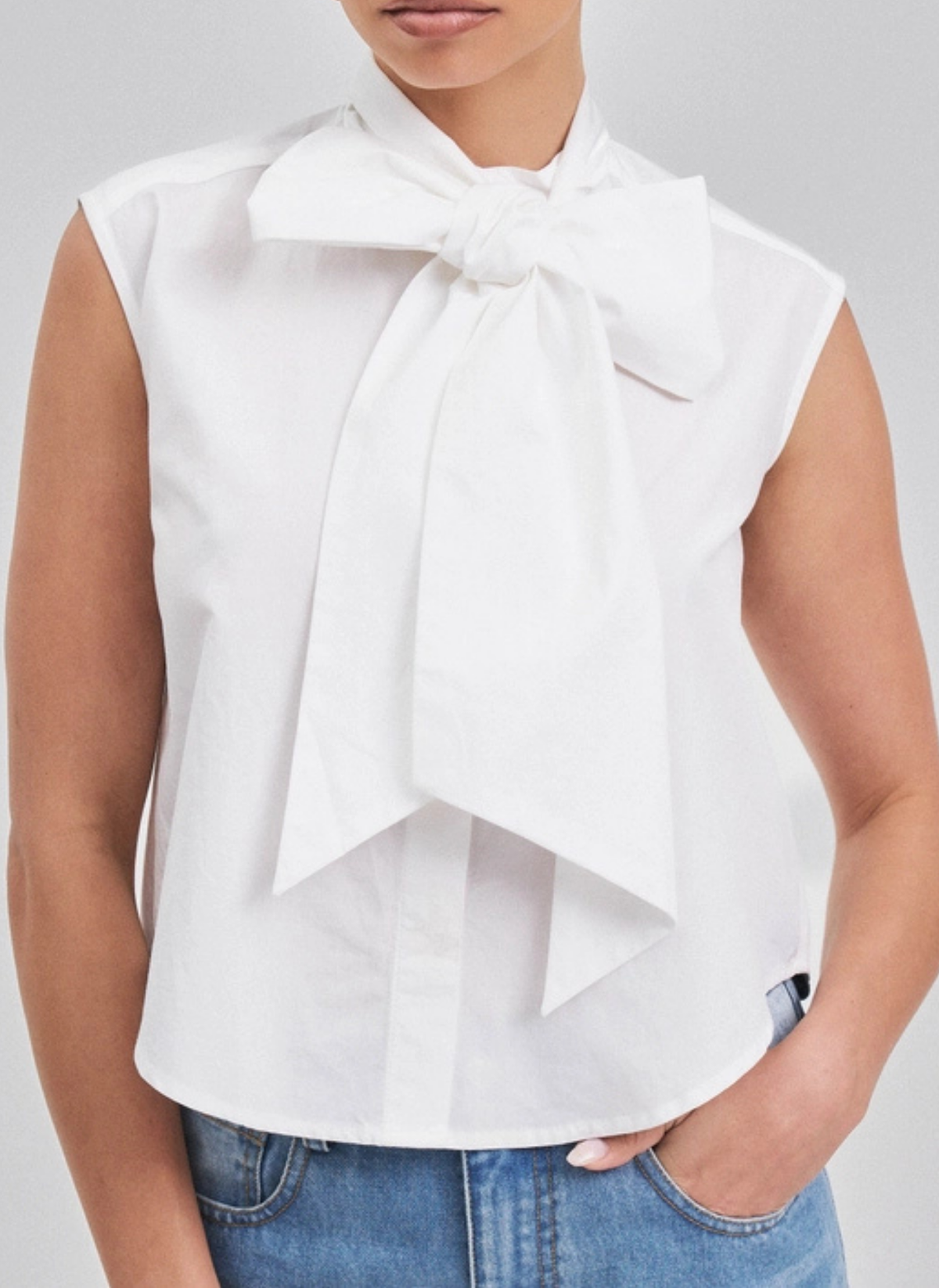 Sleeveless Bow Button Down Top